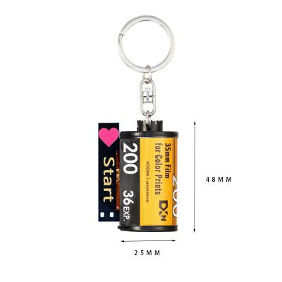 China Wholesale Custom Decorationand Photo Memorial Personalized Keychains Camera Movie Roll Key Chain With5 10 15 20 25 30 35 40 Photos for sale