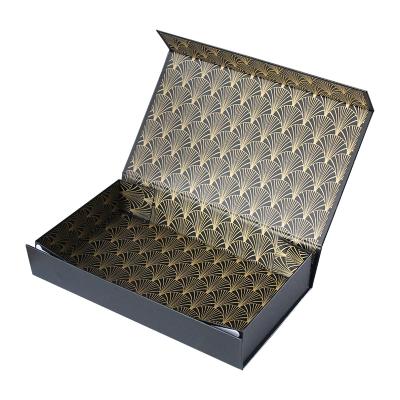 China Recyclable Matte Black Custom Logo Printed Cardboard Magnetic Folding Gift Box With Ribbon for sale