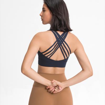 China Fashion Breathable Cross Tapes Back High Impact Lift Up Unique Sports Bra Gym Wear Women for sale