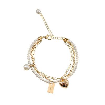 China Romantic Imitation Heart Gold Vintage Pearl Jewelry Fashion Three Layer Chain Bracelet Sweet Three Pendant Girl Ladies Accessories for sale