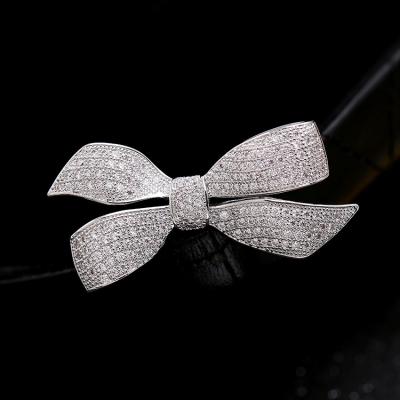 China Simple Design Women's Beautiful Elegant Wedding Crystal Brooch Pin Shiny Rhinestone Diamond Bowknot Brooch for sale