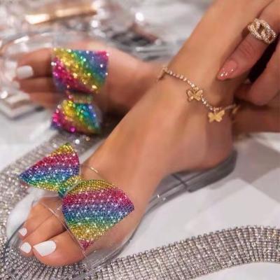 China Latest Style Fashionable Women's Flat Bow Slippers Breathable Colored Transparent Clear Sandal Slides Sandal for sale