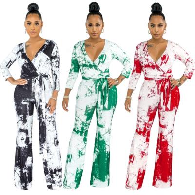 China Anti-wrinkle fashion ladies rompers casual v-neckline printed autumn loose wide leg women's one-piece overalls for sale