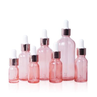 China 2021 Latest Pink Personal Care Travel Packaging Cosmetic Glass Dropper Bottle for sale