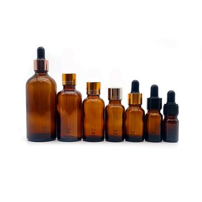 China Essential Oil Amber Glass Serum Cosmetic Empty Screw Cap Bottles With Droppers for sale