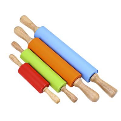 China Home Kitchen Silica Gel Flour Sticker Handle Roller Rolling Baking Solid Wood Baking Tool for sale