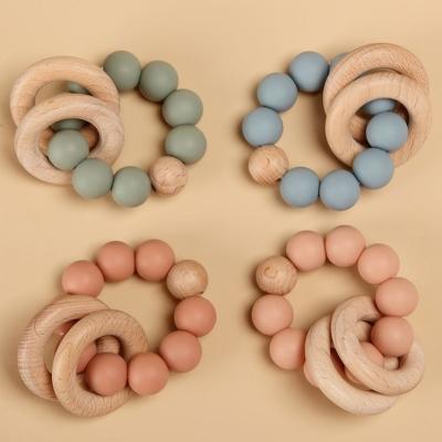 China Eco-Friendly Wholesale Non-Toxic Wooden Teether Toy Silicone Beads Baby Teether for sale