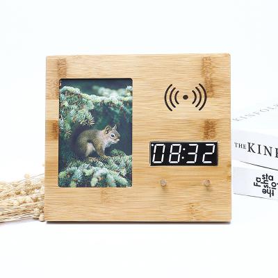 China Bamboo Wooden Digital Calendar Alarm Clock Photo Frame With Wireless Charger Temperature Calendar Clocks for sale