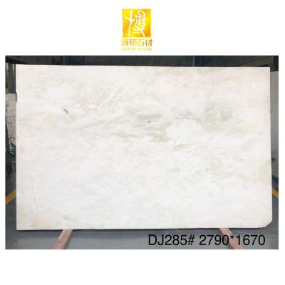 China Modern Translucent White Onyx Stone With Red Veins White Onyx Marble Slab Price for sale