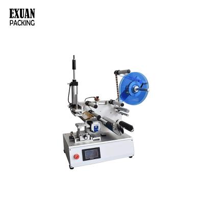 China Semi-automatic Flat Battery Labeling Machine Luggage Food Toy Labeling Machine for sale