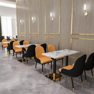 China Durable Luxury Cafe Restaurant Furniture Stainless Steel Restaurant Table And Chair Coffee Shop Around Modern Marble Dining Table Cafe So for sale