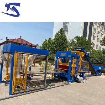 China building material shops automatic cement concrete paving interlocking hollow brick block making machine price qt4-15 for sale