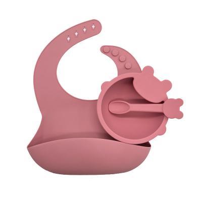 China Antibacterial Baby Supplies Silicone Baby Bibs Roll Baby Feeding Dish With Spoon for sale