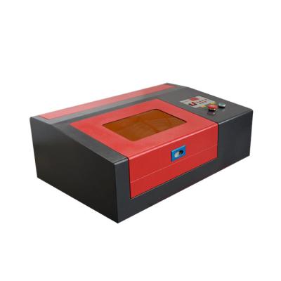 China SERVOMOTOR factory 3020 CO2 laser cutting and engraving machine rubber pad making machine MINI DIY making laser machine 300*200mm m2 for sale