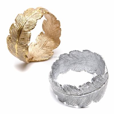 China Sustainable metal gold and silver feather napkin ring for sale