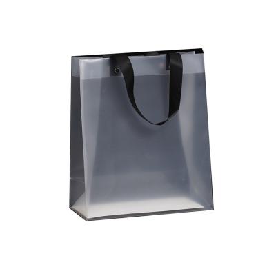 China Newest simple and beautiful vending clear frosted plastic bag clothing shopping gift bag handbag plastic packaging bag for sale