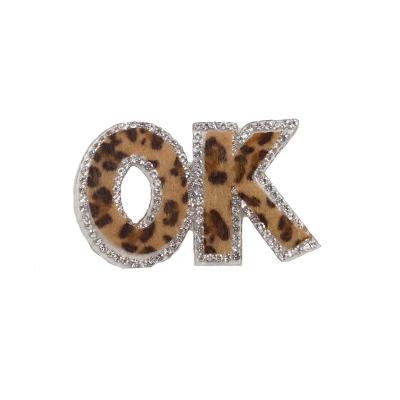 China Pointback OK Badges Rhinestone 3D Iron On Logo Patch For Apparel for sale