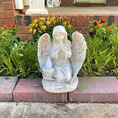 China Modern Outdoor Decor Solar LED Garden Light Resin Praying Angel Watching Over Us Statue for sale