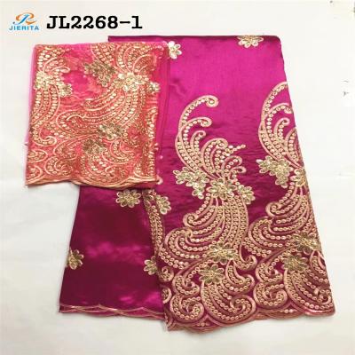 China Guangzhou good viable factory price cotton slik material embroidery with neat sequins red color georges lace use for party for sale