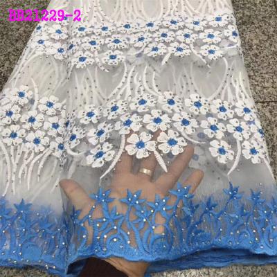 China New Design Viable Fashion Design Light Blue French Net Lace With Stones Lace Materials African Lady Dress Fabric for sale