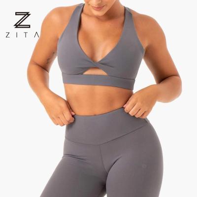 China Wholesale Breathable Plus Size Padded Twisted Sports Bra And Legging Set Women for sale