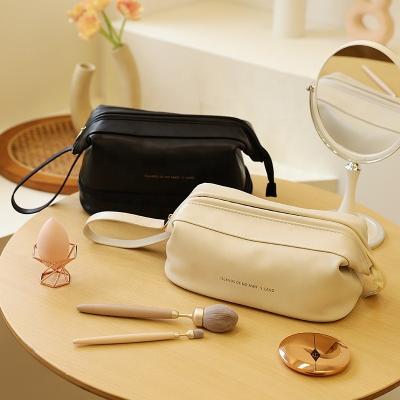 China 2022 New Fashion PU Storage Bag Large Capacity Portable Cosmetic Travel Wash Bag Women's Makeup Cloud Shape Makeup Bag for sale