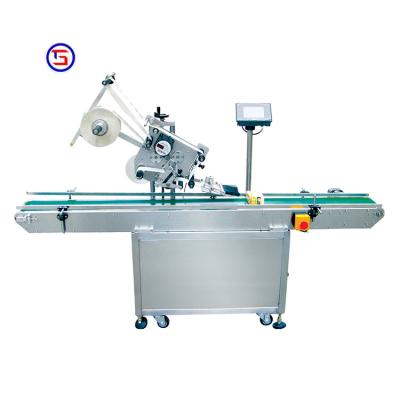 China Beverage factory price automatic small sock labeling machine bagging and labeling machine for sale for sale