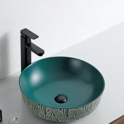 China Premium matte gloss +hand craved B style simple creative modern matte green hand craved small bathroom countertop basin balcony sink wash basin hotel residence for sale