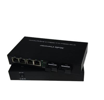 China FTTH FTTB FTTC 10/100/1000M BIDI Media Converter With 1*9 Module 20KM SC Fiber Optic Media Converter With 2 SFP Slots 4 Ports RJ45 for sale