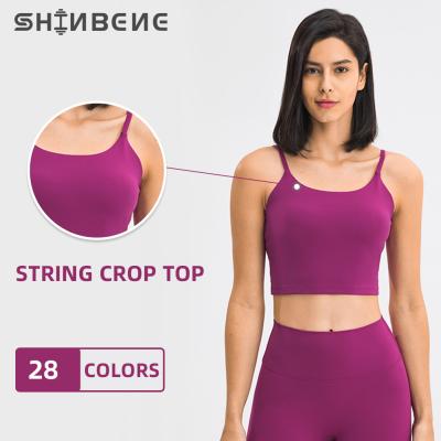 China Custom Workout Gym Bras Sweat-Wicking SHINBENE Logo Women Thong Sports Fitness Crop Top With Built In Bra for sale