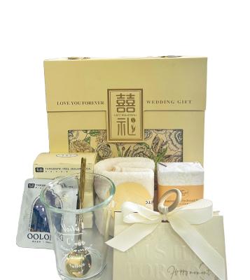 China Personalized Wedding Gift Set Towel Soap Water Cup Oolong Tea and Creative Candy Box for sale