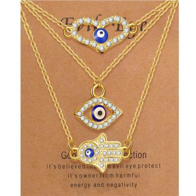 China Hot Selling FASHIONABLE Hot Selling Amazon Devil's Eye Palm Pendant Necklaces Multilayer High-Grade Diamond Evil Angel Eyes Women Necklace for sale