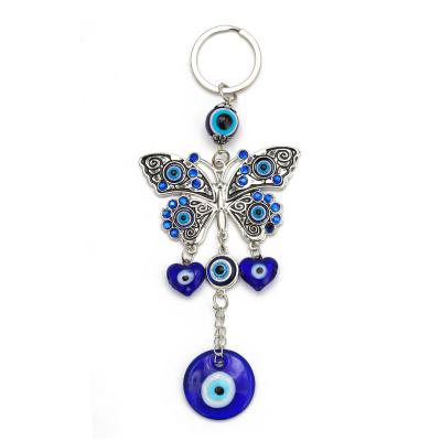 China New Creative Daily Life Devil's Eye Keychains Fashion Hot Turkish Blue Eyes Butterfly Key Pendants Evil Eyes Key Chain for sale