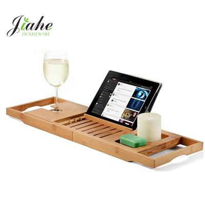 China Sustainable Expandable Wooden Bath Tray Bamboo Bathtub Caddy Tray with Extending Arms for sale