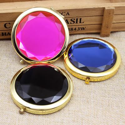 China Charm Double Sides Lighted Crystal Foldable Smart Pocket Makeup Mirror With Logo Design for sale