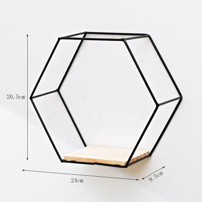 China Fashionable Black Multifunctional Decoration Metal Wall Shelf Hexagon Wall Hanging Decoration Storage Shelves for sale