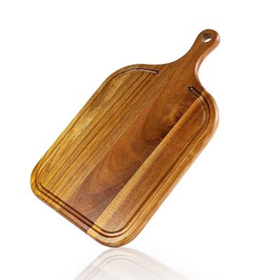 China Viable acacia wood cutting board with handle (17 x 10 inches) for sale