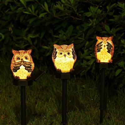 China Europe Polyresin Owl Statue Garden Decoration With Solar Light Outdoor Decorative Stake Lights for sale