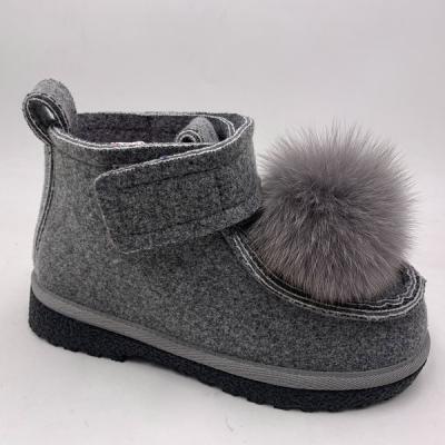 China Flat 2022 Women Shoes Ankle Boots With Fluffy Ball And Elastic Soft Winter Woolen Material for sale