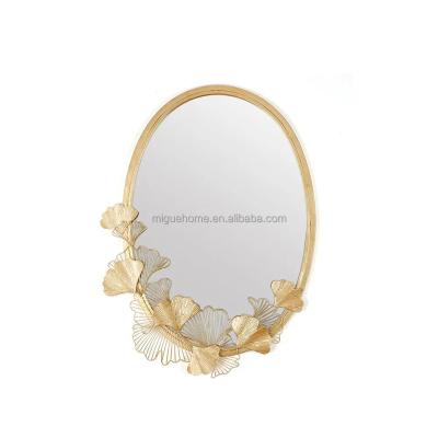 China Modern Wall Mirror Glamorous Gold Oval Wall Mirror Hollow Out Metal Ginkgo Leaves For Living Room for sale