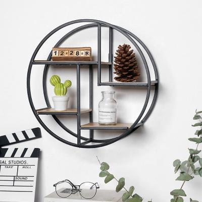 China Nordic Minimalist Central Institute of Statistics Wrought Iron Wall Shelf Home Living Room Bedroom Wall Storage Rack Creative Wholesale for sale