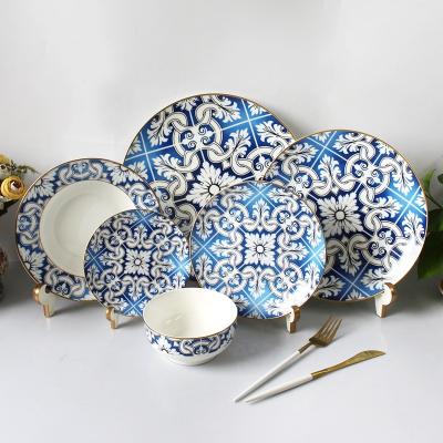 China Sustainable Modern Design Gold Rim Western Dinnerware Sets Wedding Porcelain Bone White And Blue Dinnerware for sale