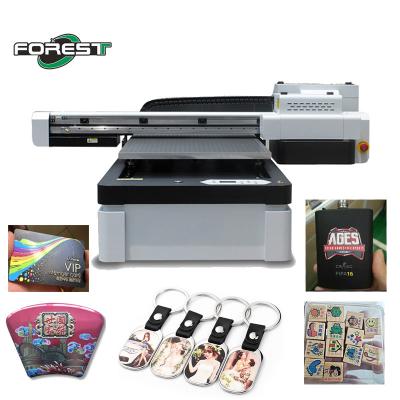 Cina CMYK Color UV Flatbed Printer Rotary Flatbed LED UV Printer in vendita