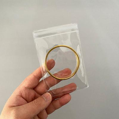 China Fashionable Minimalism Pouch Jewelry Display Bag Portable Transparent Clear Jewelry Packaging Pouch With Adhesive Zipper Sealing for sale