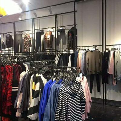 China Factory Wholesale Double Sided Clothes Display Wall Shelf High End Store Clothes Display Rack for sale