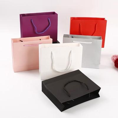 China Logo Cosmetics Luxury Gift Recyclable Custom Christmas Fashion Pink Square Clothes Branded Printing Small Manufacturers Portable Paper Bag for sale