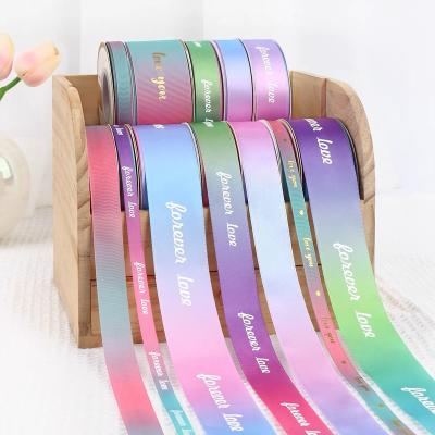 China Luster Wholesale 100% Polyester Satin Grosgrain Rainbow Holographic Fashion Reflective Halloween Rope Ribbon Striped Cable Floral Logo for sale