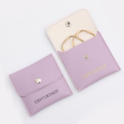 China Luxury Elegant Purple Leather Jewelery Bag Ring Bracelet Necklace Snap Closure Jewelry Pouch Bag With Custom Logo for sale