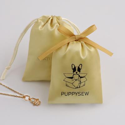 China Morden yellow luxury satin drawstring pouches, personalized jewelry packaging bags, gift packaging pouches for sale