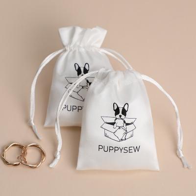 China Custom 50 Modern Luxury White Drawstring Jewelry Pouches, Wedding Gift Packaging Bags Dust Bags With Printed Logo for sale